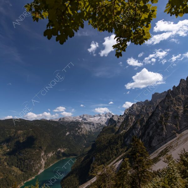 austria hallstat montagne mountains lago lake smeraldo emerald nuvole clouds